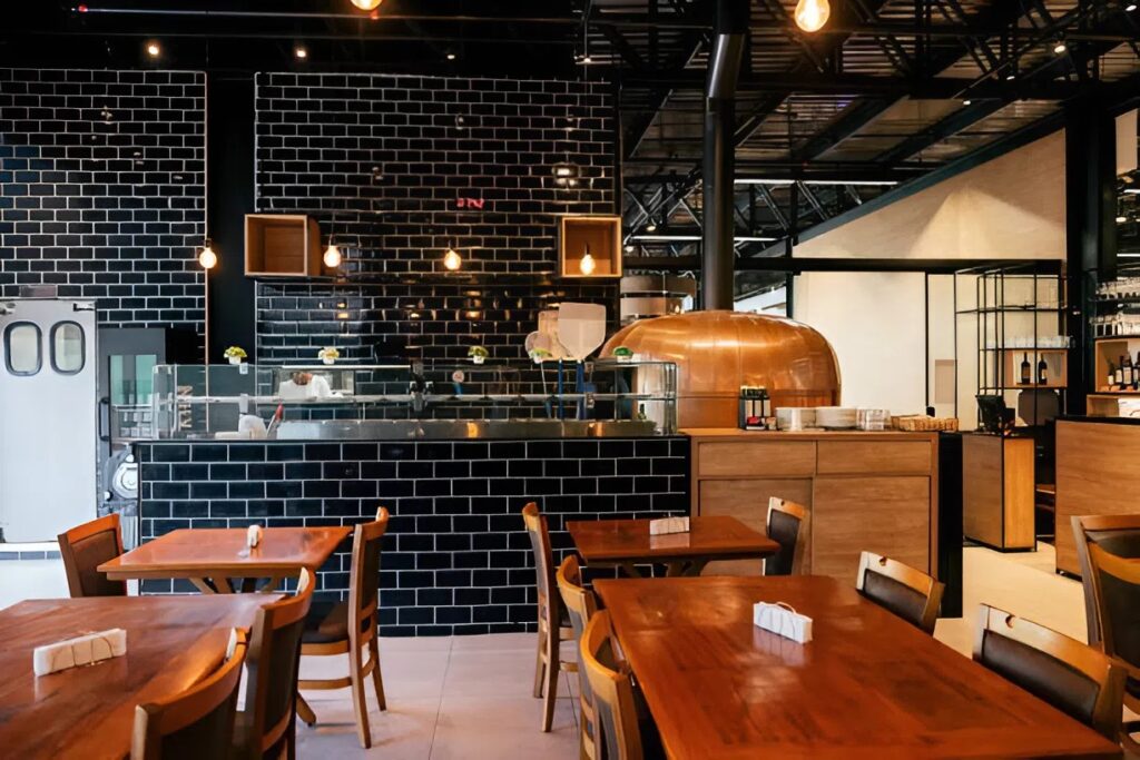 Modern eatery design with black subway tile and warm wood finishes by an interior painter in Broadmoor, CO