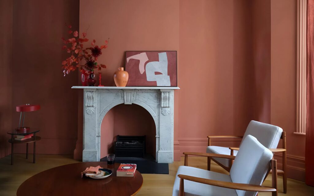 Living room with russet walls designed by an interior painter in Old Colorado City, CO