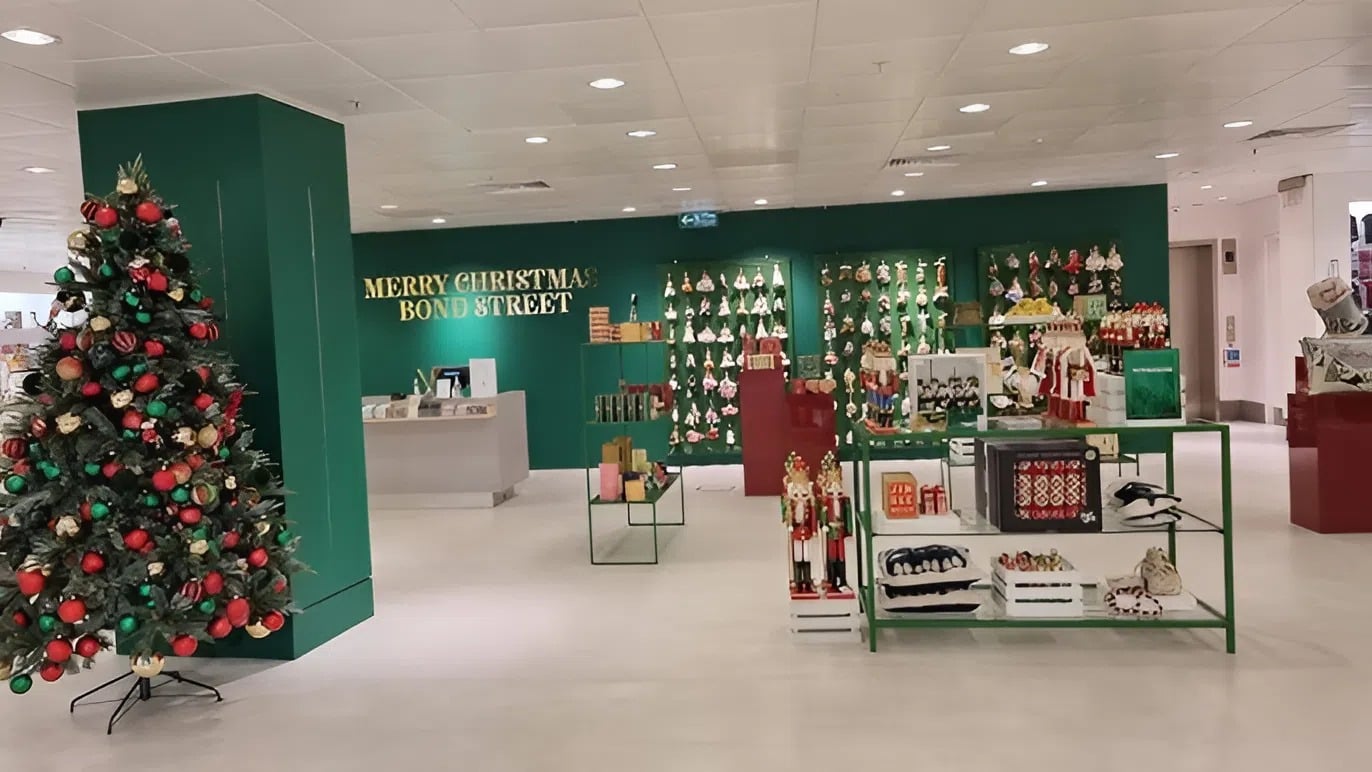Holiday retail display with green painted walls and festive store accents by an interior painter in Broadmoor, CO