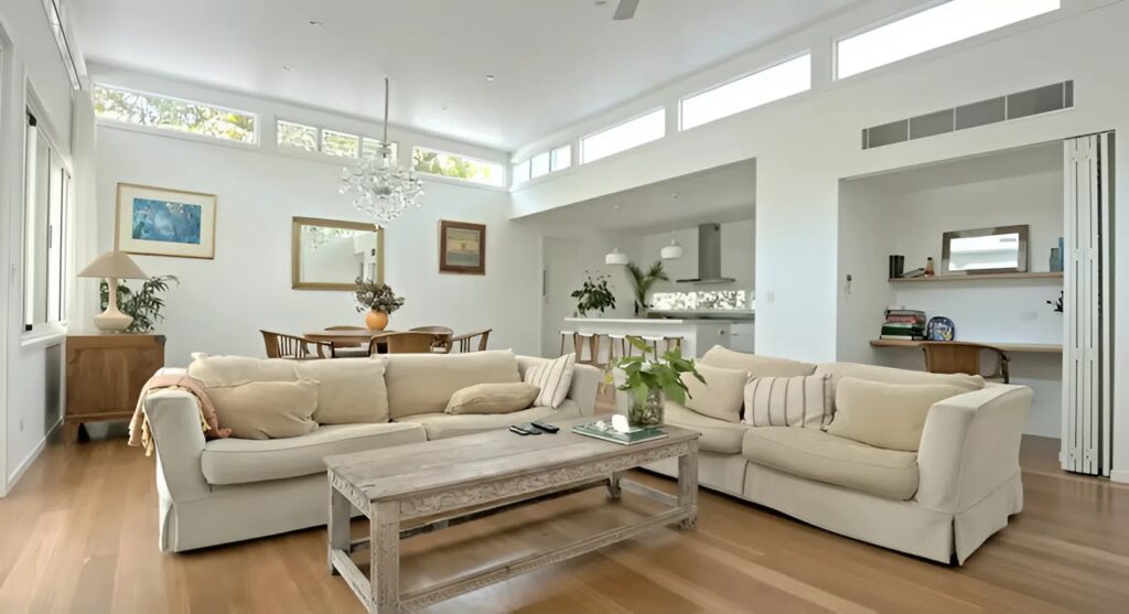 Bright living room with freshly painted white walls and smooth finish by a house painter in Broadmoor, CO