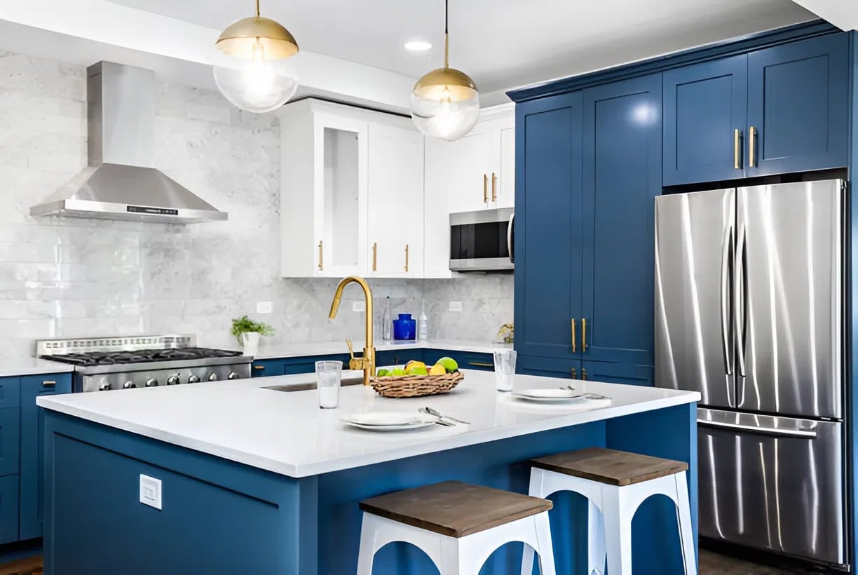 Freshly painted blue kitchen cabinets with gold hardware, completed by a painter in Old Colorado City