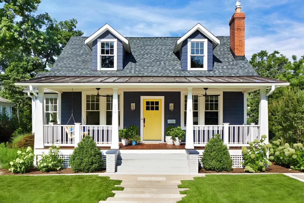Freshly painted home exterior with bold blue siding and crisp white trim by an expert exterior painter in Cathedral Pines, CO